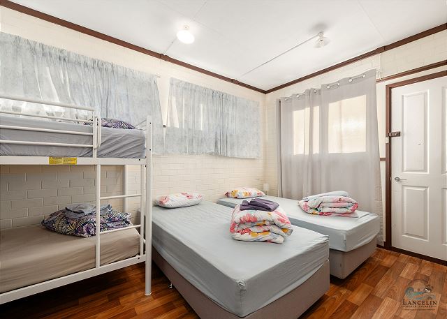 Family room with bunk bed and single beds