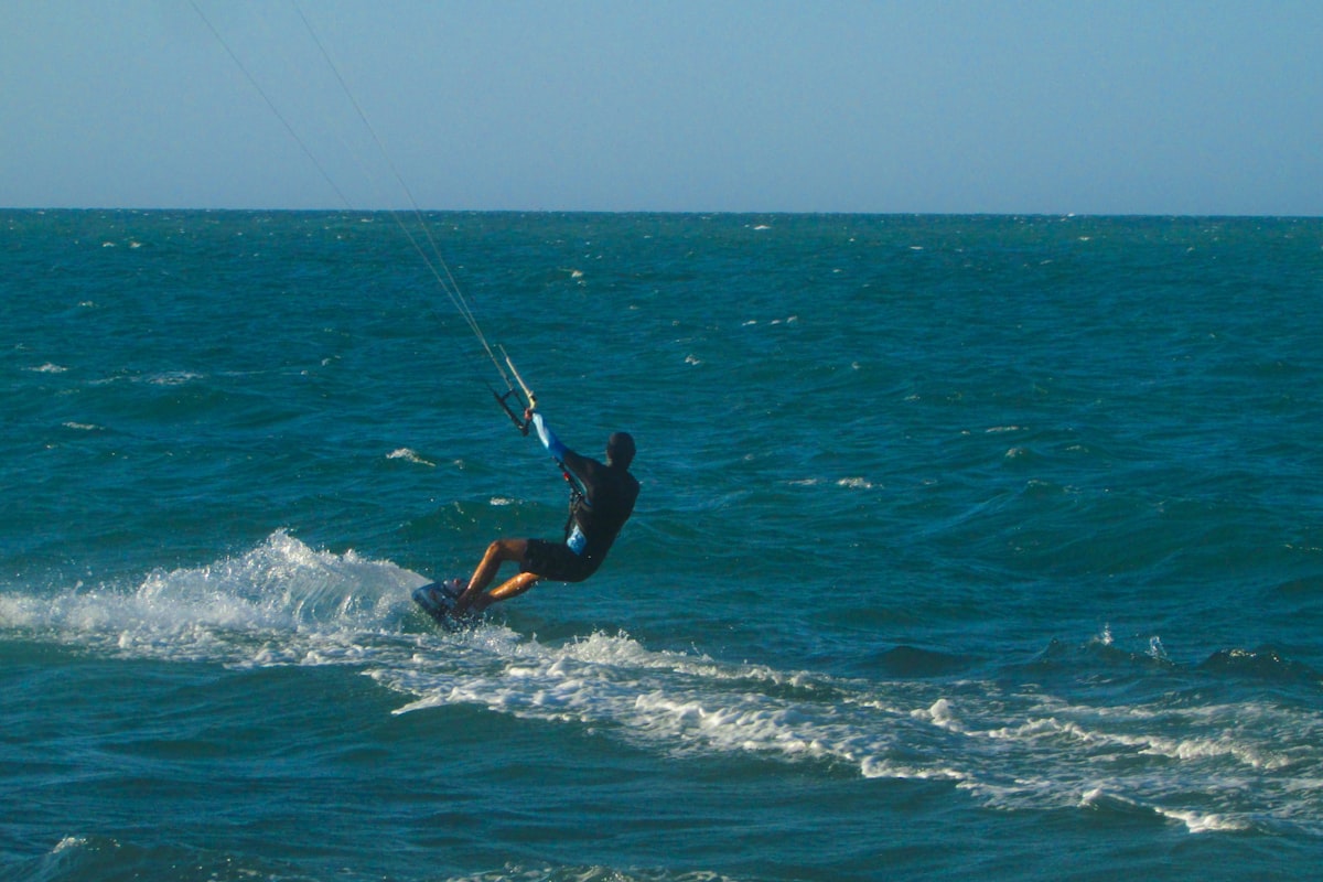 Kitesurfer on turquoise ocean